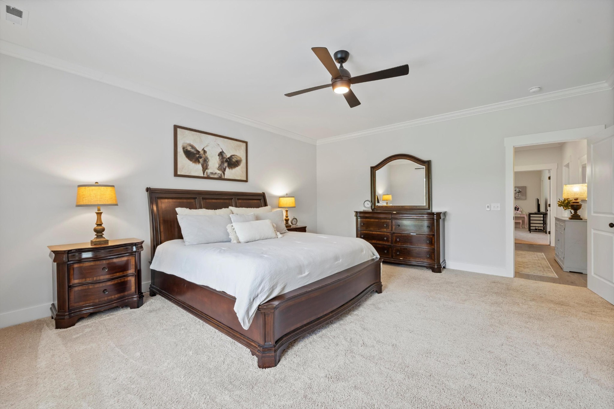 9638 Dutton Lane Ooltewah, TN 37363 - Photo 22 of 38 a spacious bedroom with a bed and dresser