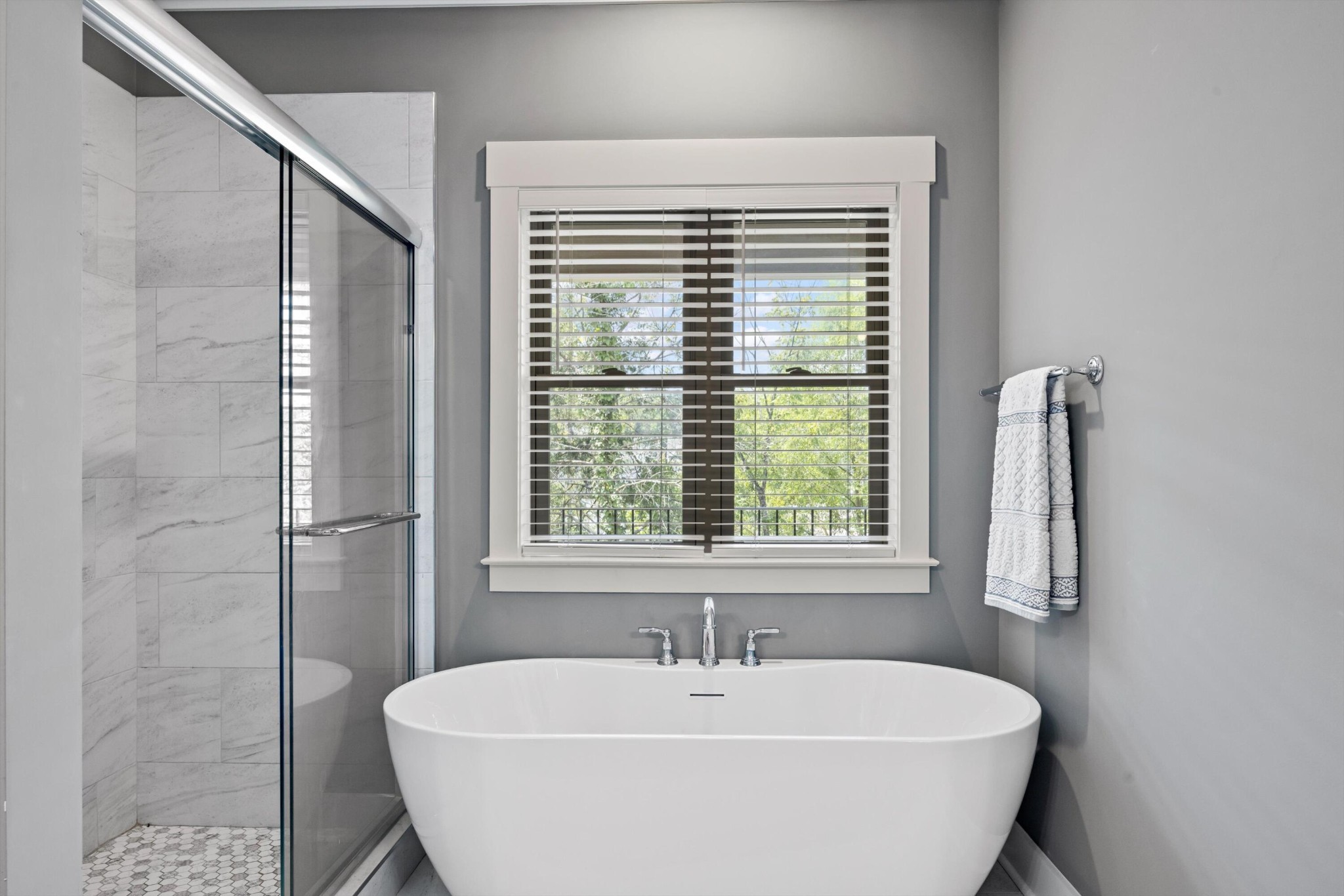 9638 Dutton Lane Ooltewah, TN 37363 - Photo 25 of 38 a white bath tub sitting in a bathroom next to a window