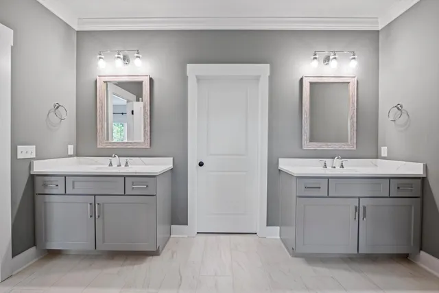 a view of walk in closet with clothes