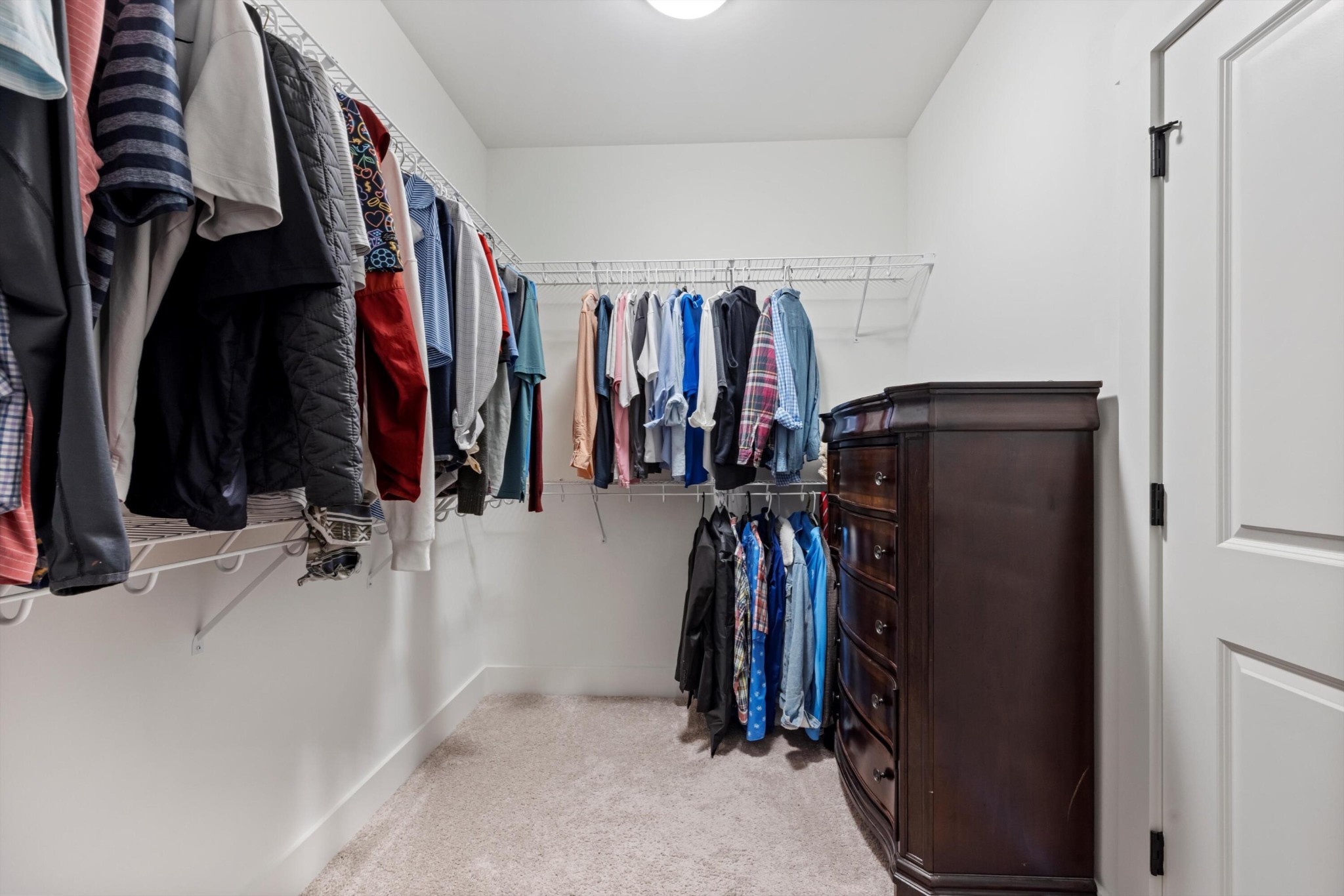 9638 Dutton Lane Ooltewah, TN 37363 - Photo 28 of 38 a view of walk in closet with clothes