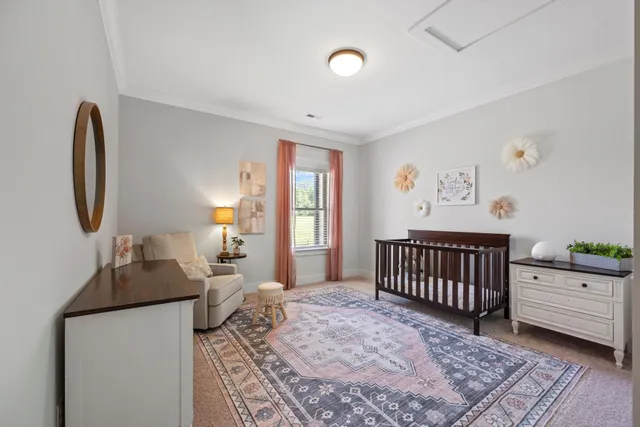 a view of a hallway with closet and window