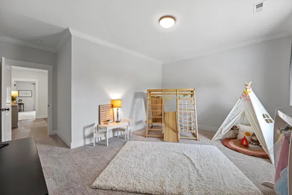 a view of a livingroom with furniture and a flat screen tv