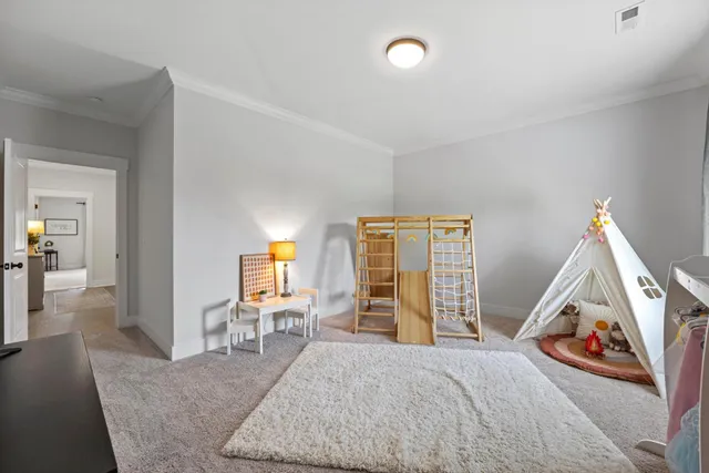 a view of a livingroom with furniture and a flat screen tv
