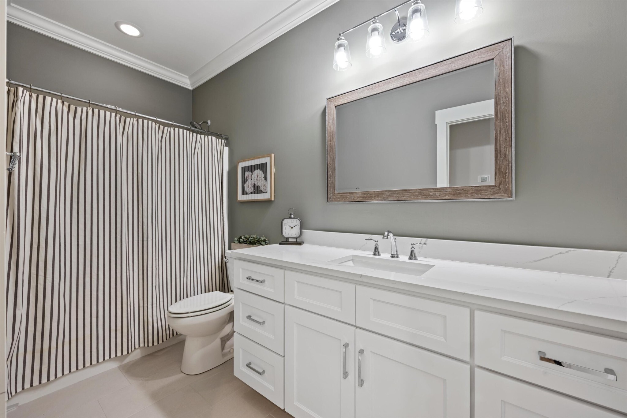 9638 Dutton Lane Ooltewah, TN 37363 - Photo 34 of 38 a bathroom with a toilet sink and mirror