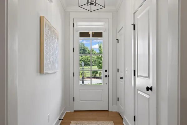a view of a hallway with washer and dryer