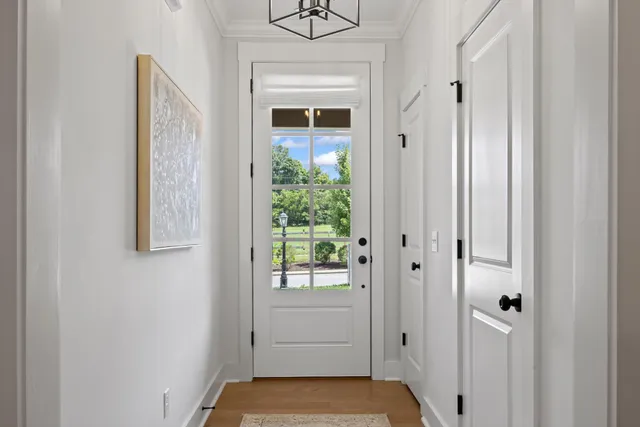 a view of a hallway with washer and dryer