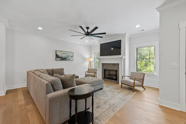 a large kitchen with kitchen island granite countertop lots of white cabinets appliances and furniture