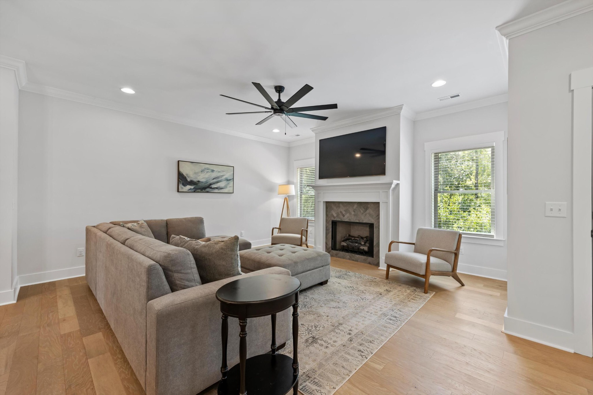 9638 Dutton Lane Ooltewah, TN 37363 - Photo 7 of 38 a living room with furniture a fireplace and a flat screen tv