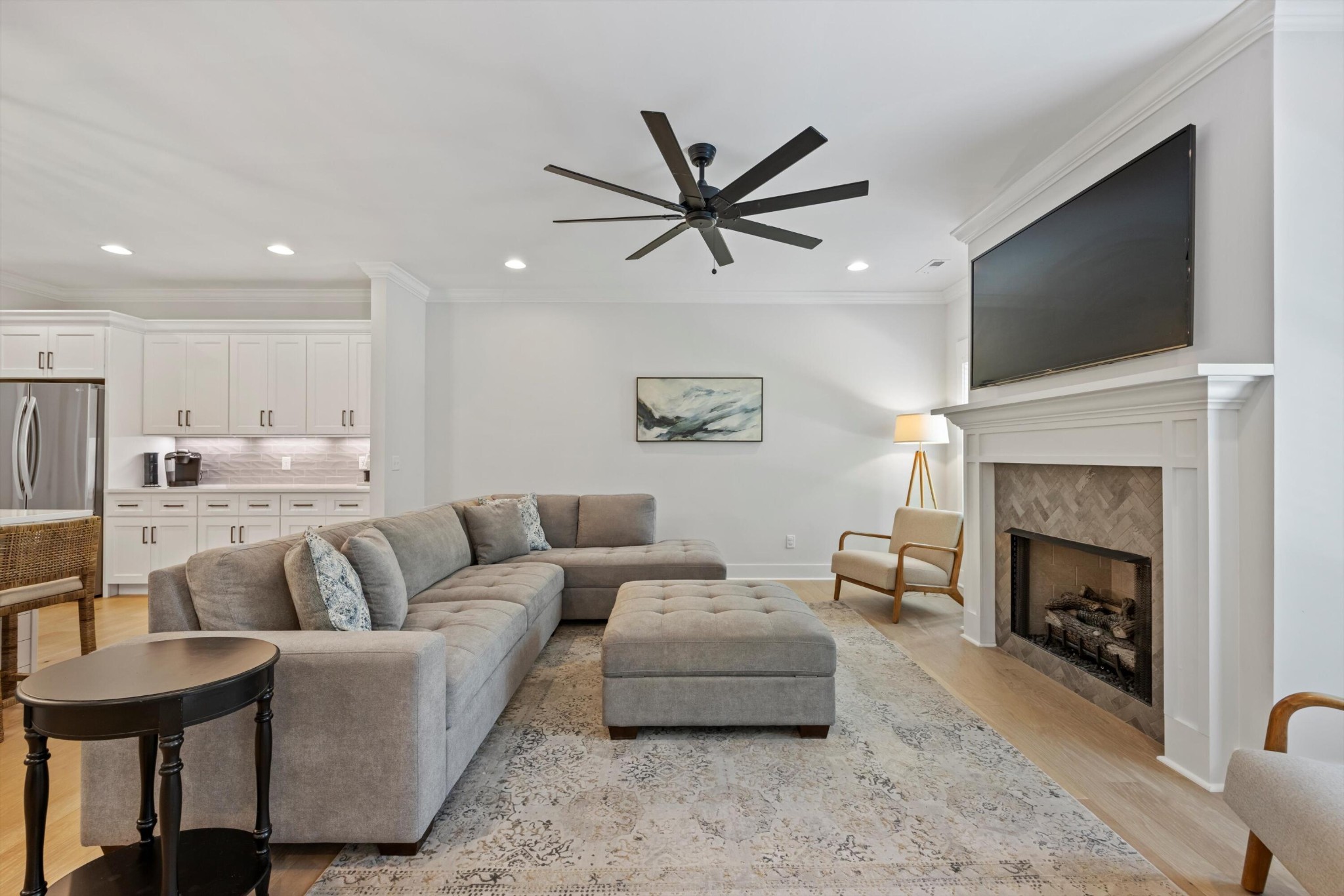 9638 Dutton Lane Ooltewah, TN 37363 - Photo 9 of 38 a living room with furniture a fireplace and a flat screen tv