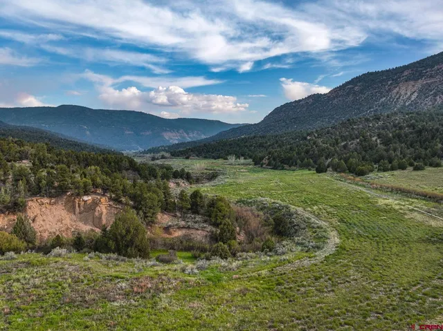 a view of a lake with mountains in the background