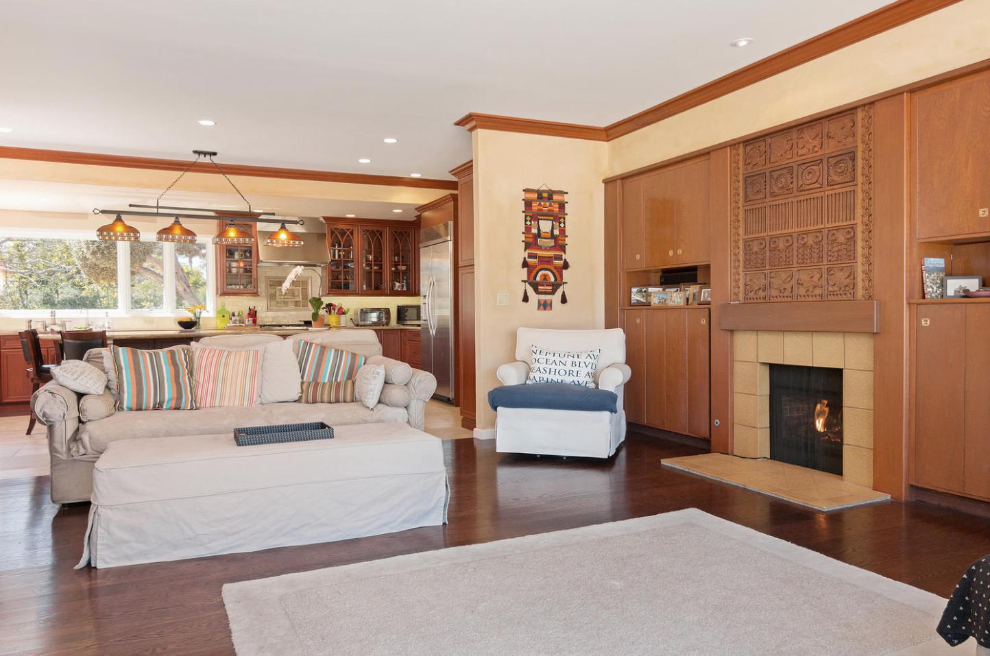 4460 Via Alegre Santa Barbara, CA 93110 - Photo 11 of 28 a living room with furniture large windows and a fireplace
