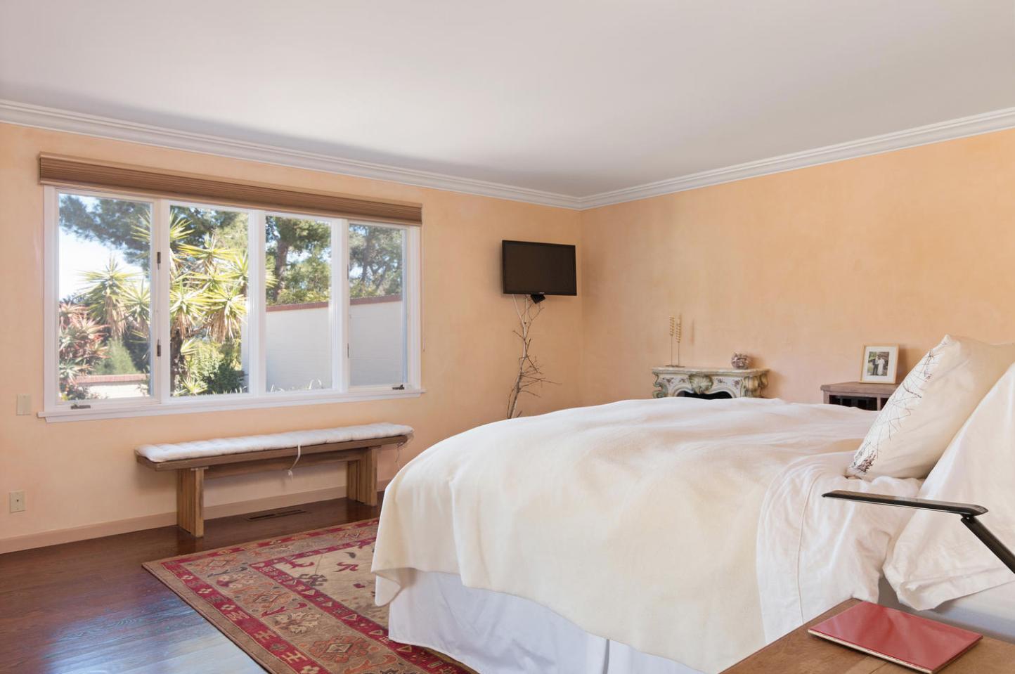 4460 Via Alegre Santa Barbara, CA 93110 - Photo 13 of 28 a bedroom with a bed and a flat screen tv