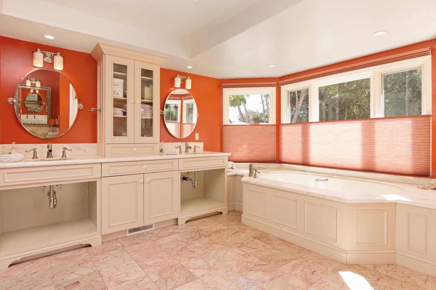 4460 Via Alegre Santa Barbara, CA 93110 - Photo 14 of 28 a bathroom with a sink and a large mirror