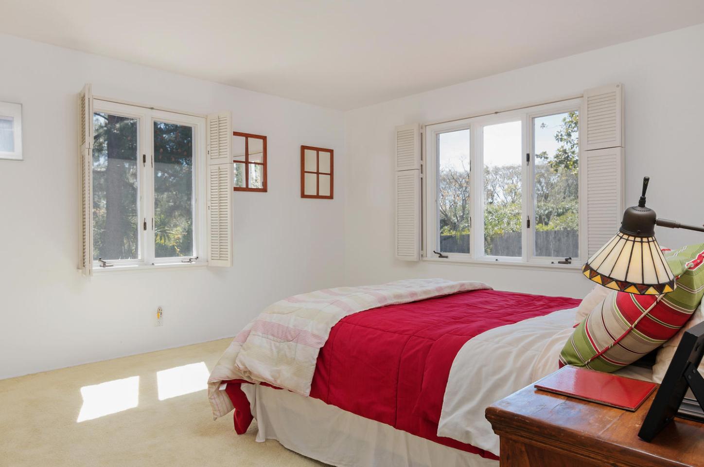 4460 Via Alegre Santa Barbara, CA 93110 - Photo 16 of 28 a bedroom with a bed and wooden floor