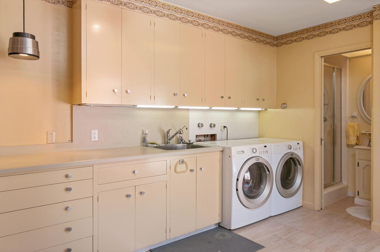 4460 Via Alegre Santa Barbara, CA 93110 - Photo 18 of 28 a utility room with sink dryer and washer