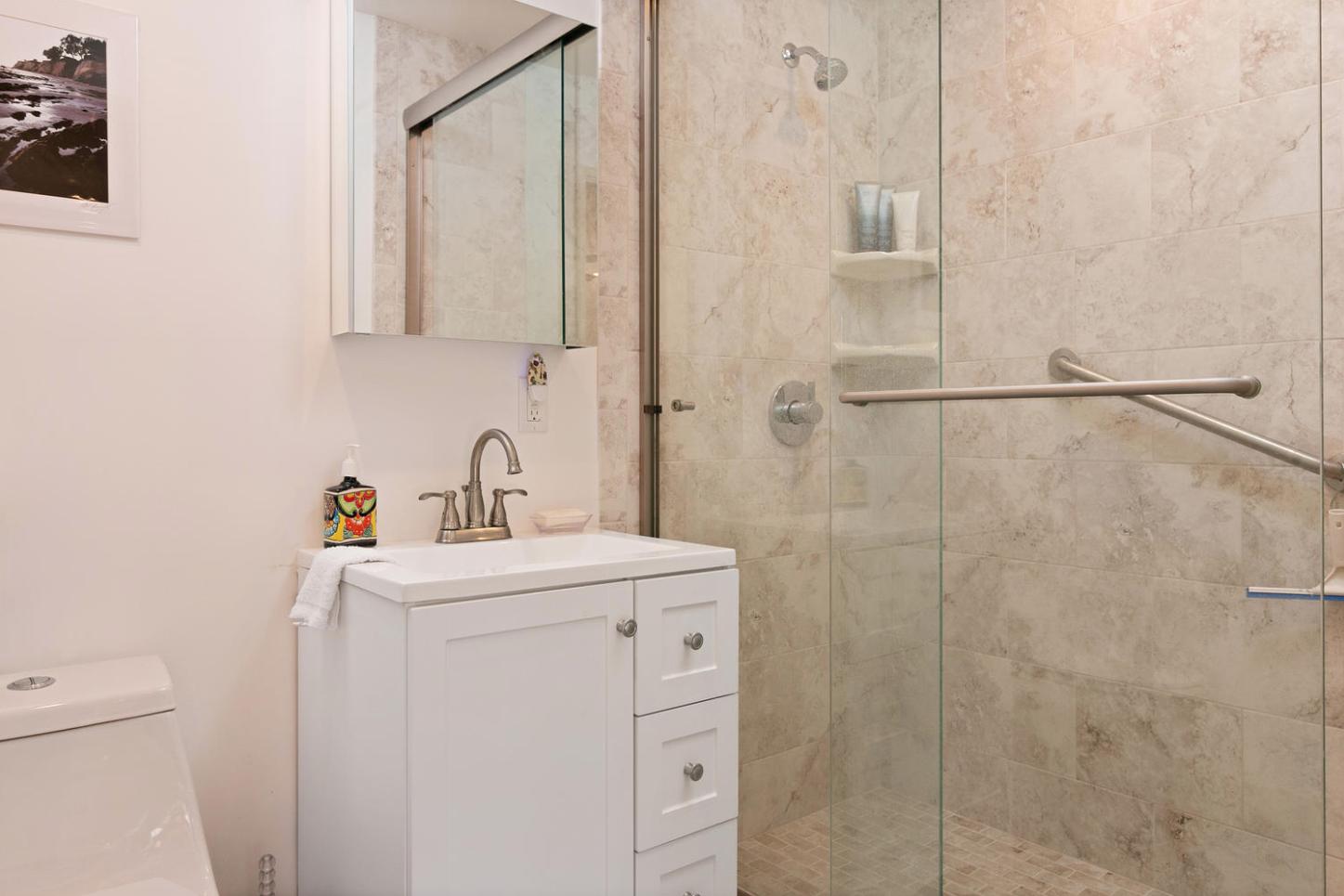 4460 Via Alegre Santa Barbara, CA 93110 - Photo 23 of 28 a bathroom with a sink a toilet and shower