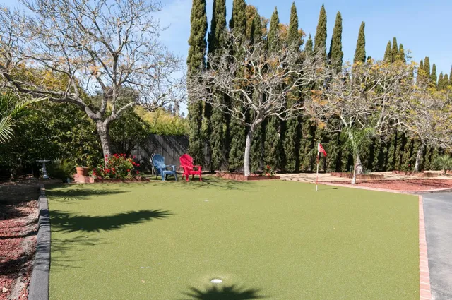 a view of a playground with basketball court