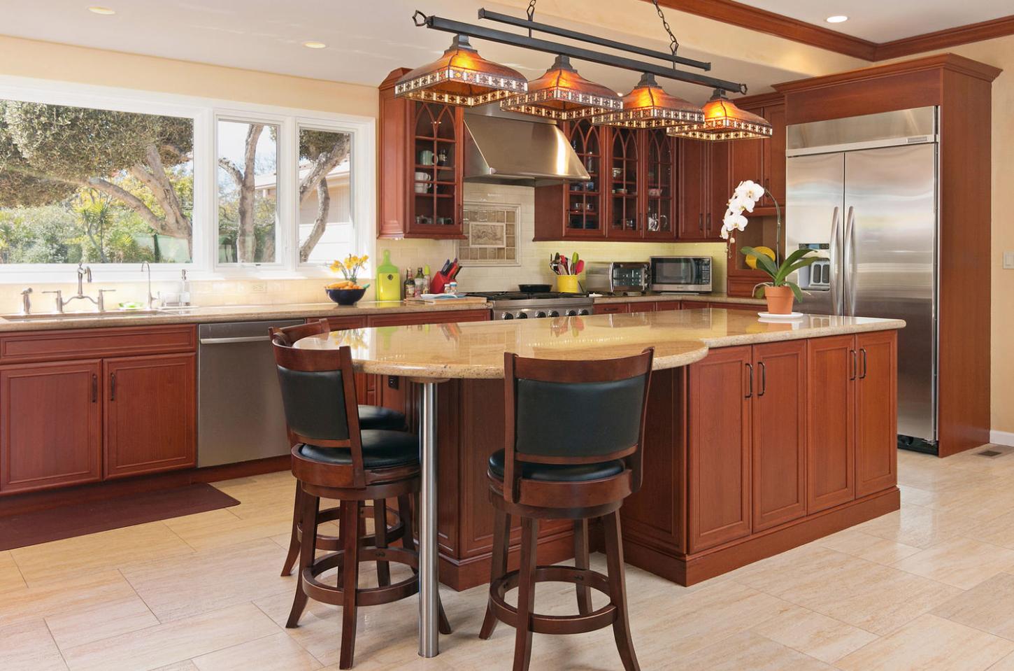 4460 Via Alegre Santa Barbara, CA 93110 - Photo 7 of 28 a kitchen with a sink and chairs
