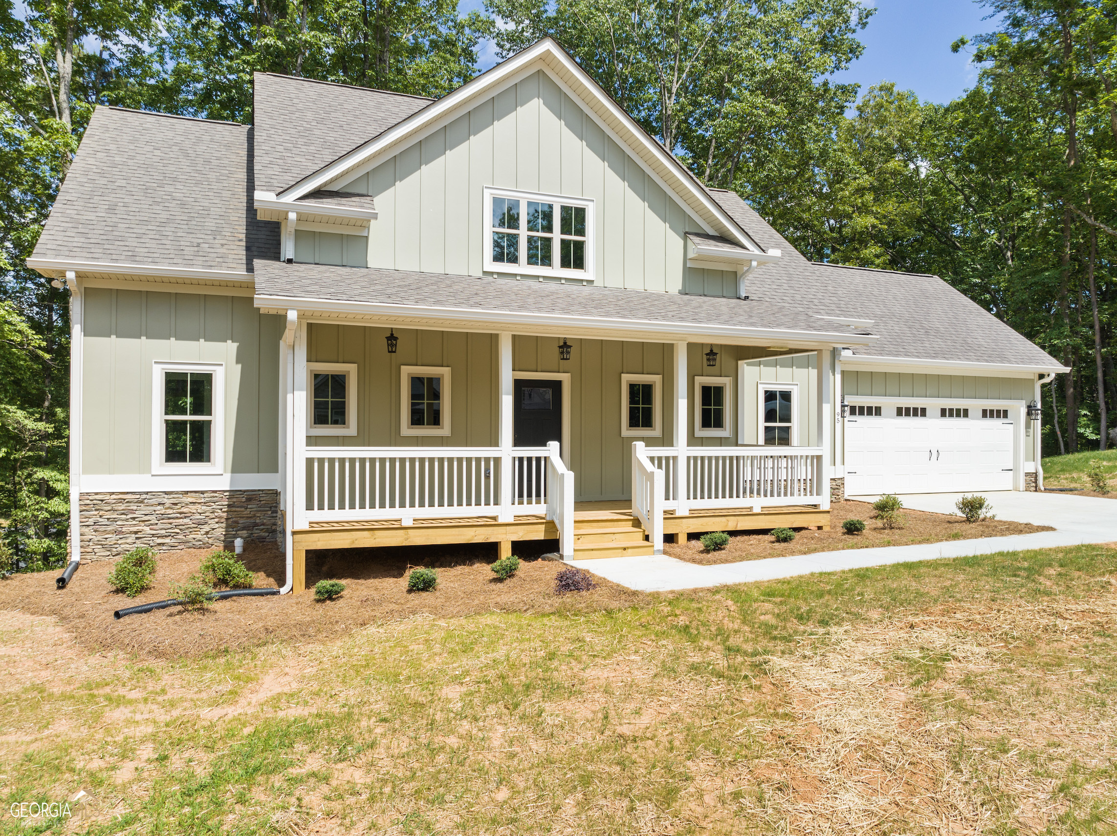 95 Smoke Rdg Way Cleveland, GA 30528 - Photo 1 of 1 a front view of a house with a yard outdoor seating and garage