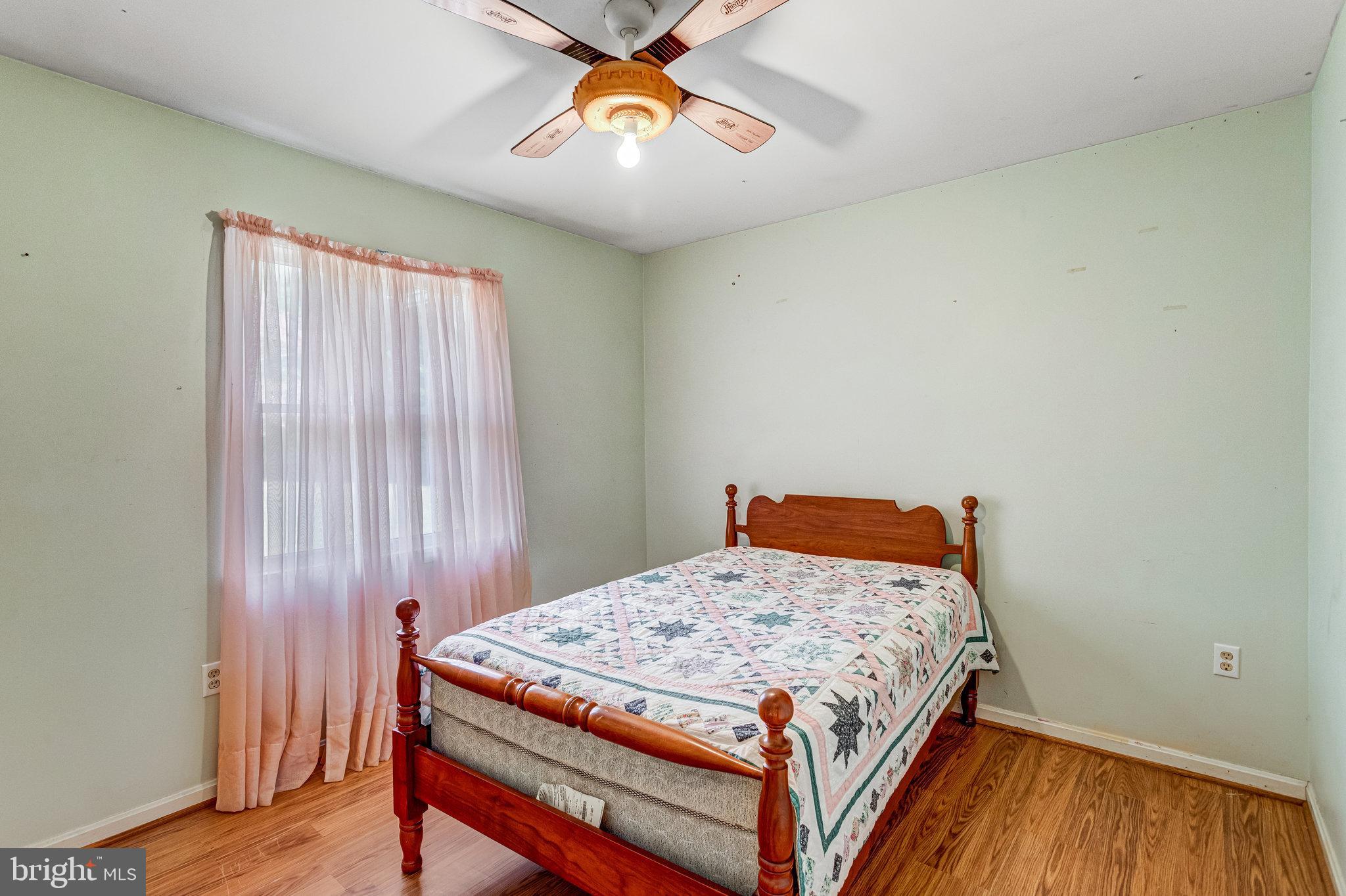 13200 Marsh Road Bealeton, VA 22712 - Photo 12 of 20 a bedroom with a bed and wooden floor