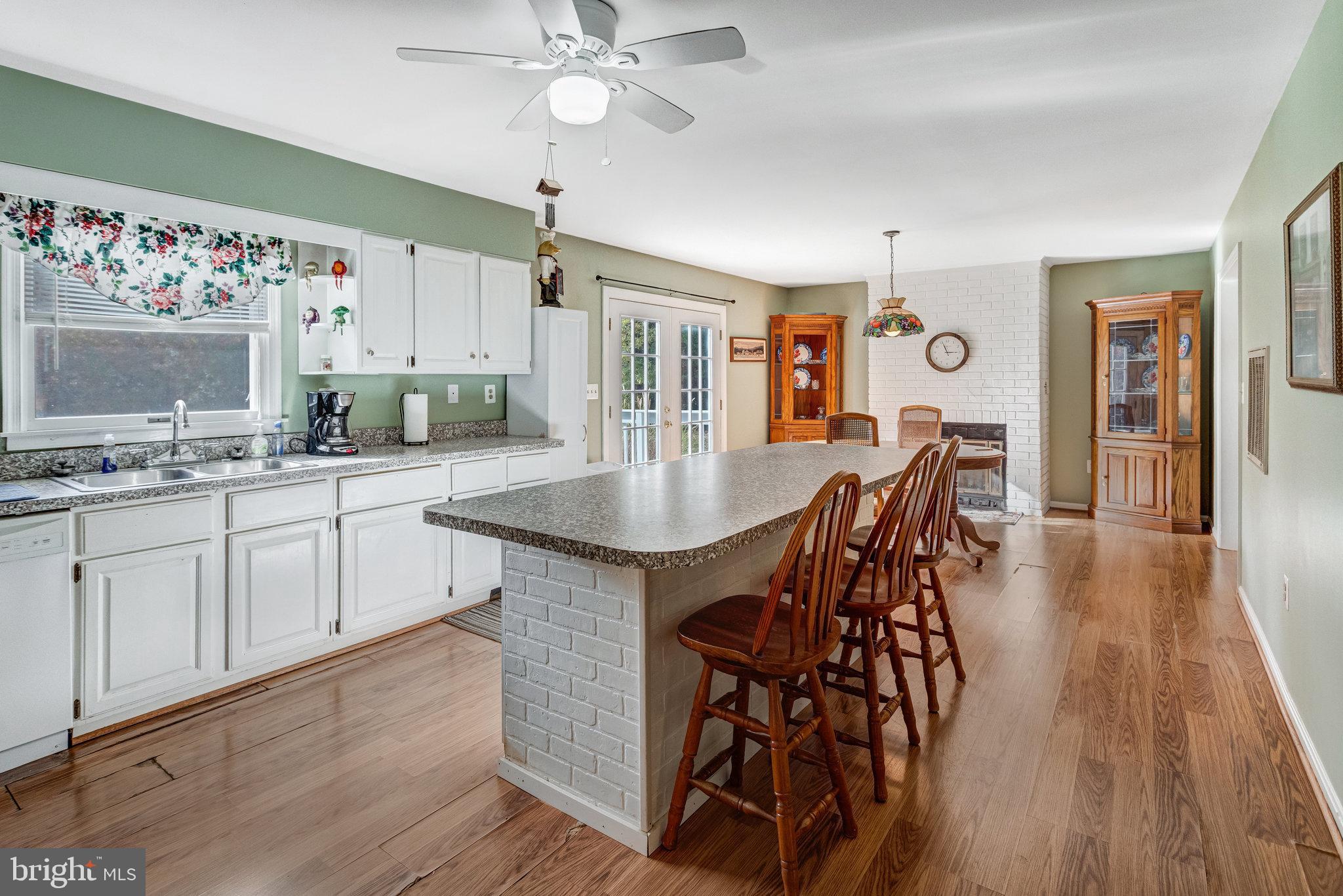 13200 Marsh Road Bealeton, VA 22712 - Photo 8 of 20 a large kitchen with a table and chairs