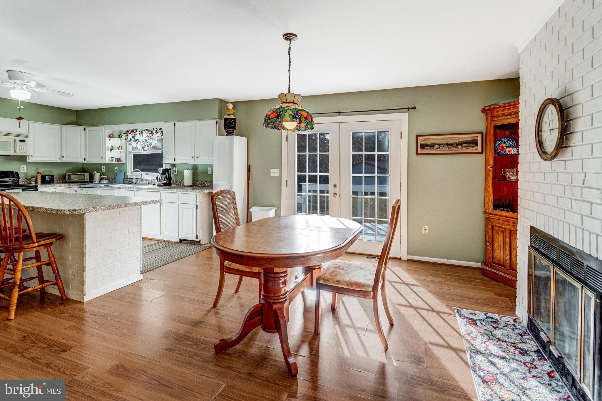 13200 Marsh Road Bealeton, VA 22712 - Photo 9 of 20 a dining room with furniture and wooden floor