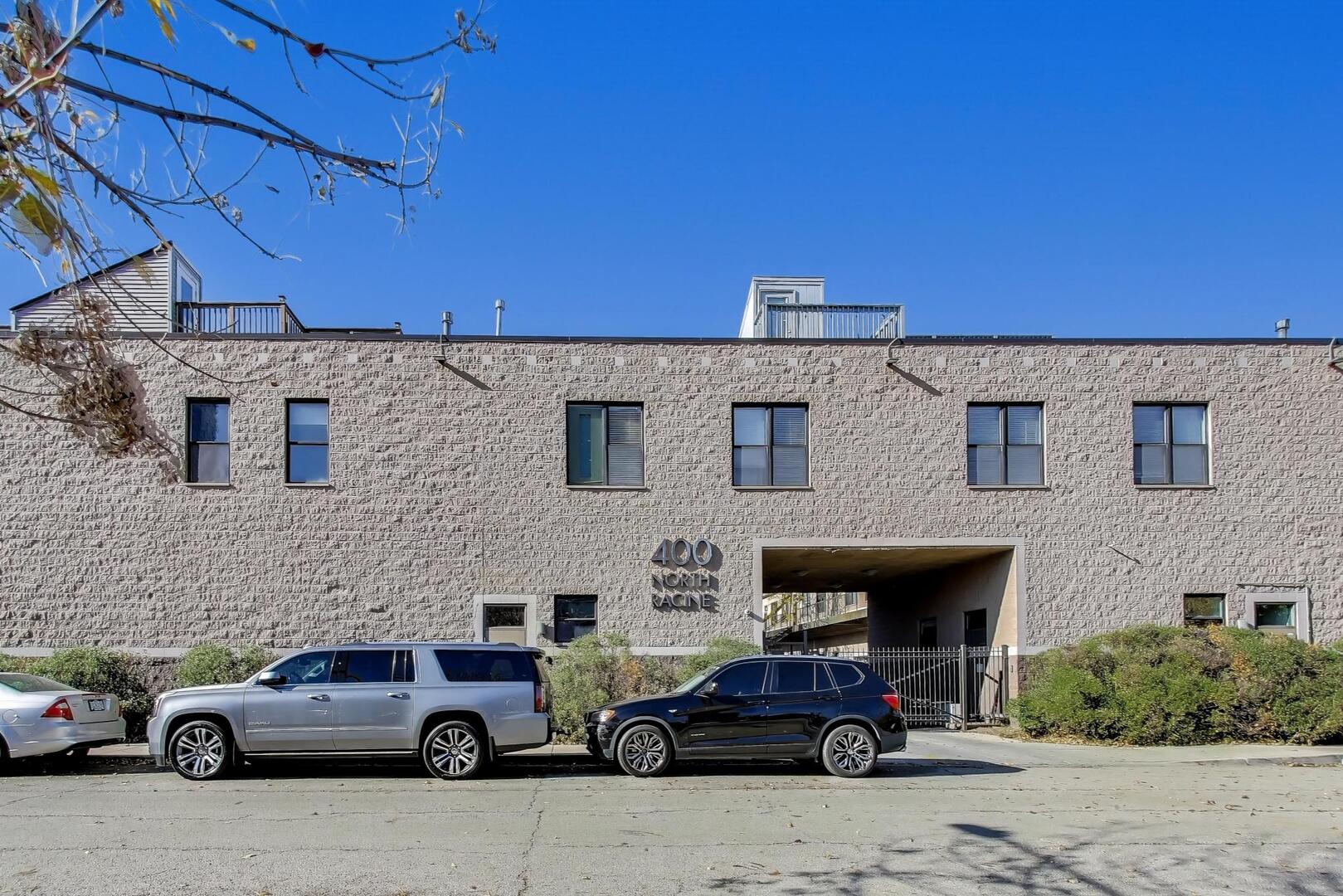 400 North Racine Avenue, Unit 204 Chicago, IL 60642 - Photo 1 of 28 a car parked in front of a building