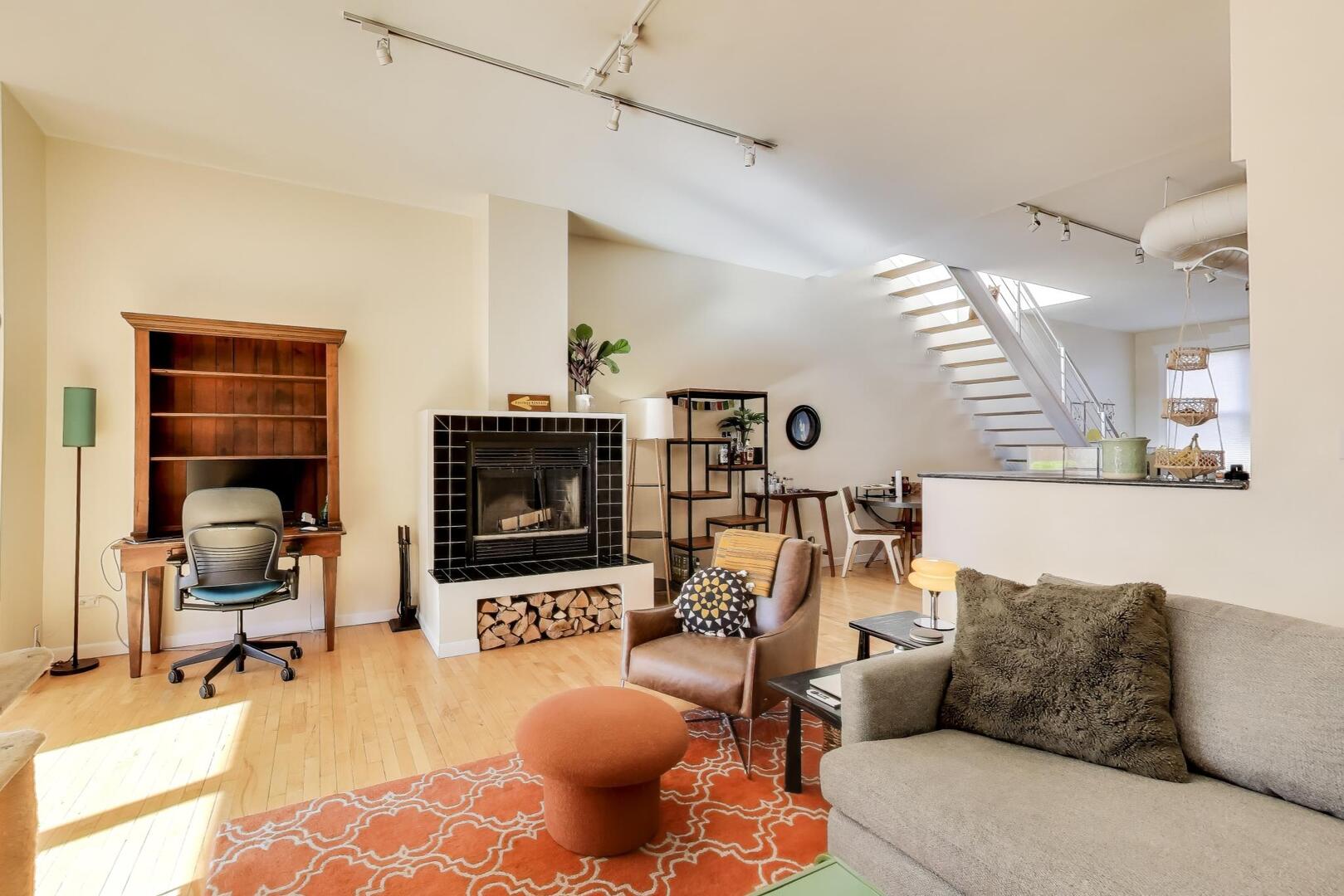 400 North Racine Avenue, Unit 204 Chicago, IL 60642 - Photo 12 of 28 a living room with furniture and a flat screen tv