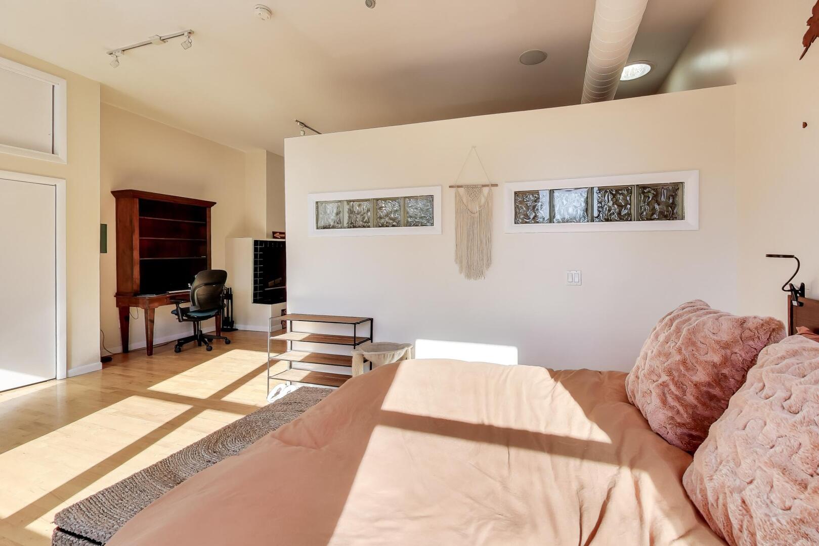 400 North Racine Avenue, Unit 204 Chicago, IL 60642 - Photo 21 of 28 a bed room with a bed and a chair