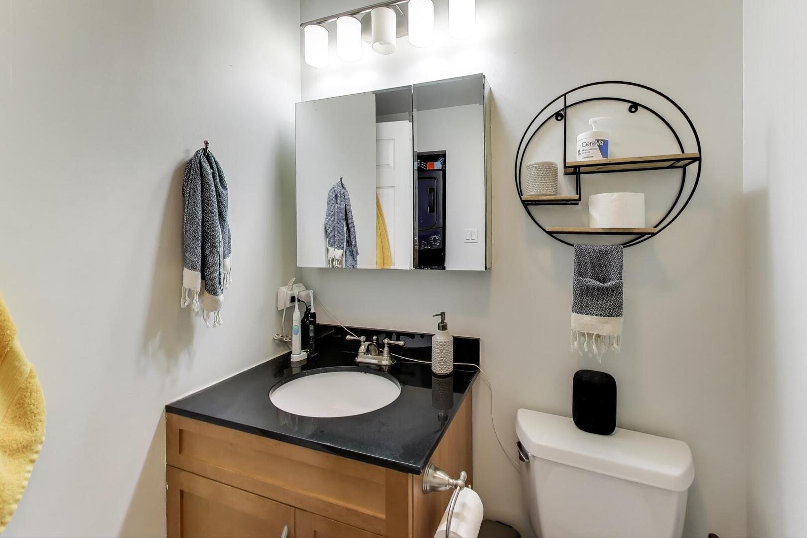 400 North Racine Avenue, Unit 204 Chicago, IL 60642 - Photo 22 of 28 a bathroom with a toilet sink and mirror
