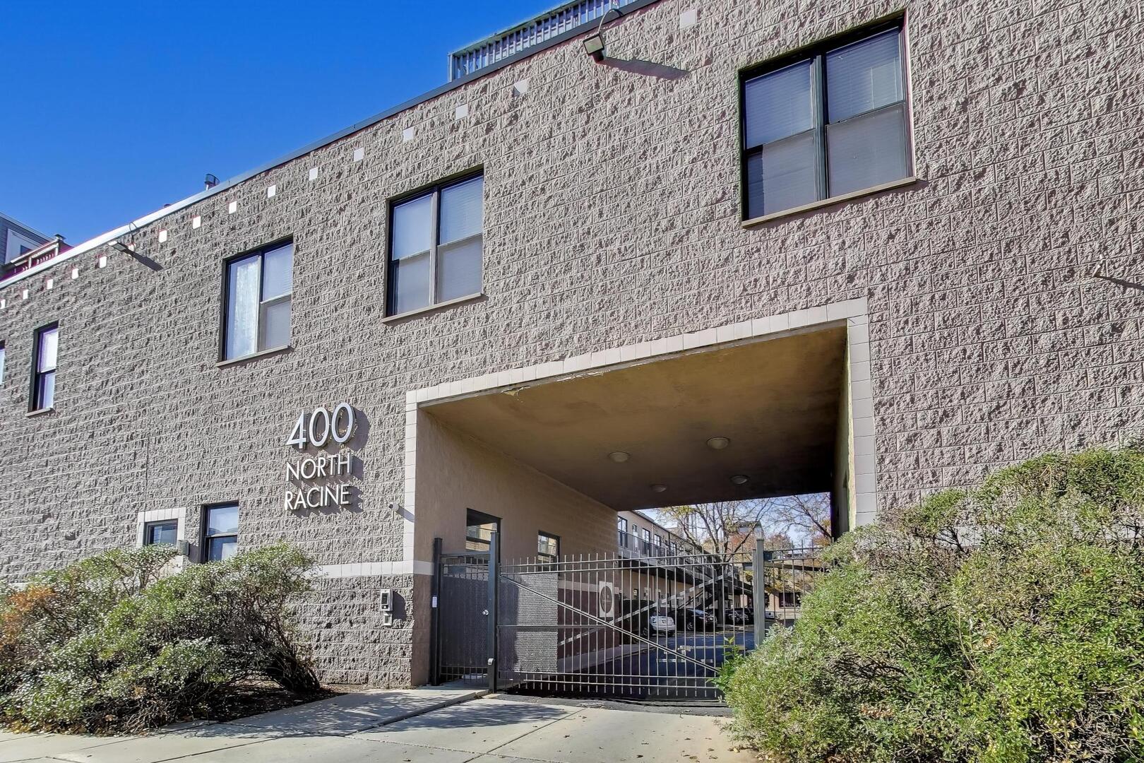 400 North Racine Avenue, Unit 204 Chicago, IL 60642 - Photo 3 of 28 a front view of a house with plants