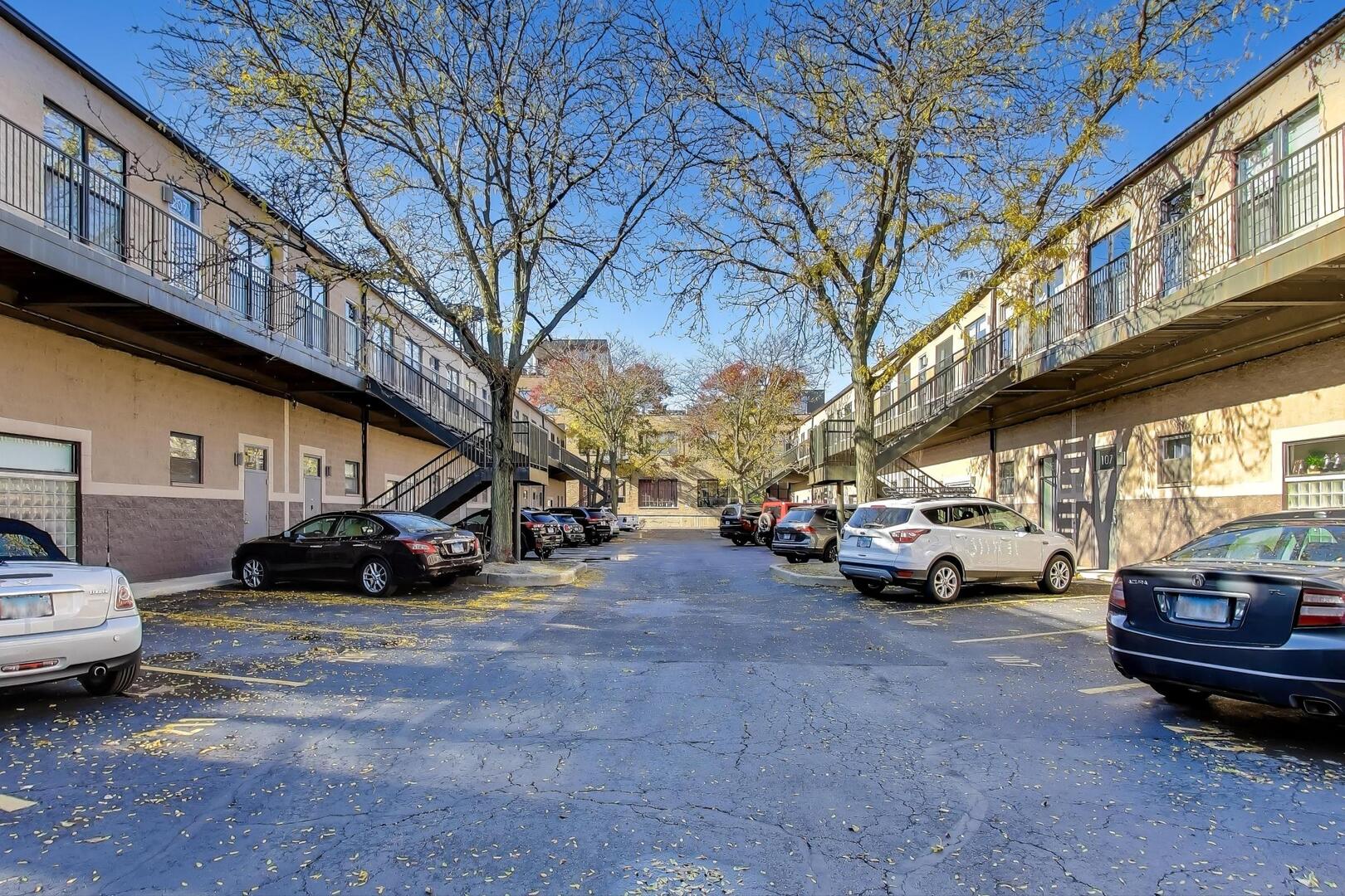 400 North Racine Avenue, Unit 204 Chicago, IL 60642 - Photo 5 of 28 a view of cars parked in a parking lot