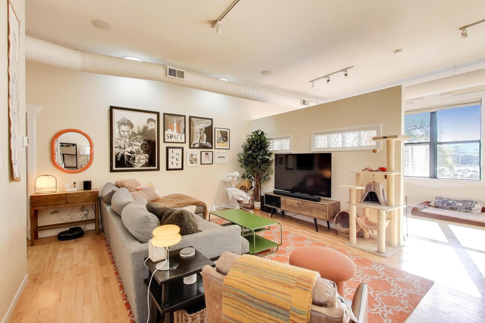 400 North Racine Avenue, Unit 204 Chicago, IL 60642 - Photo 10 of 28 a living room with furniture and a flat screen tv