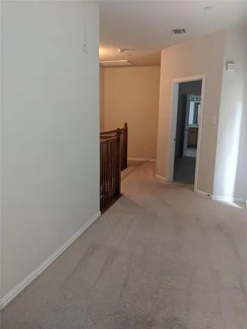 a view of hallway with closet