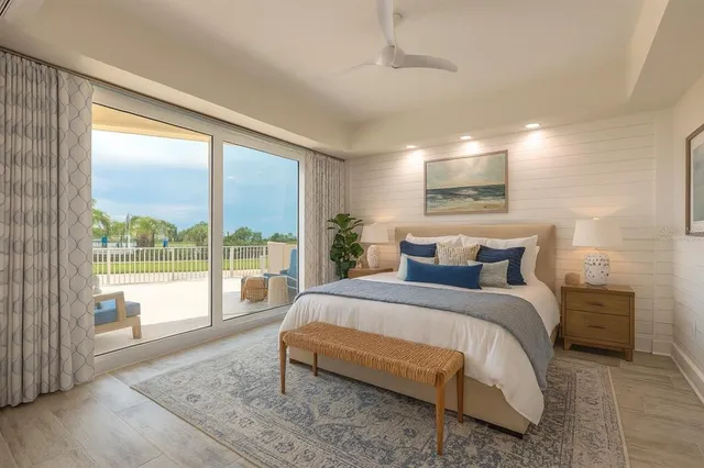 a bedroom with a large bed and a large window