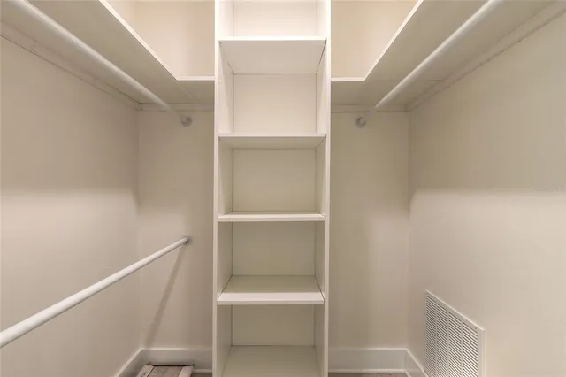 a view of an empty walk in closet