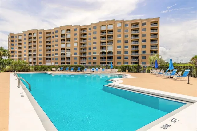 a view of building with swimming pool