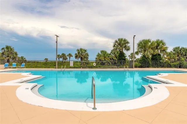a view of a swimming pool with a terrace