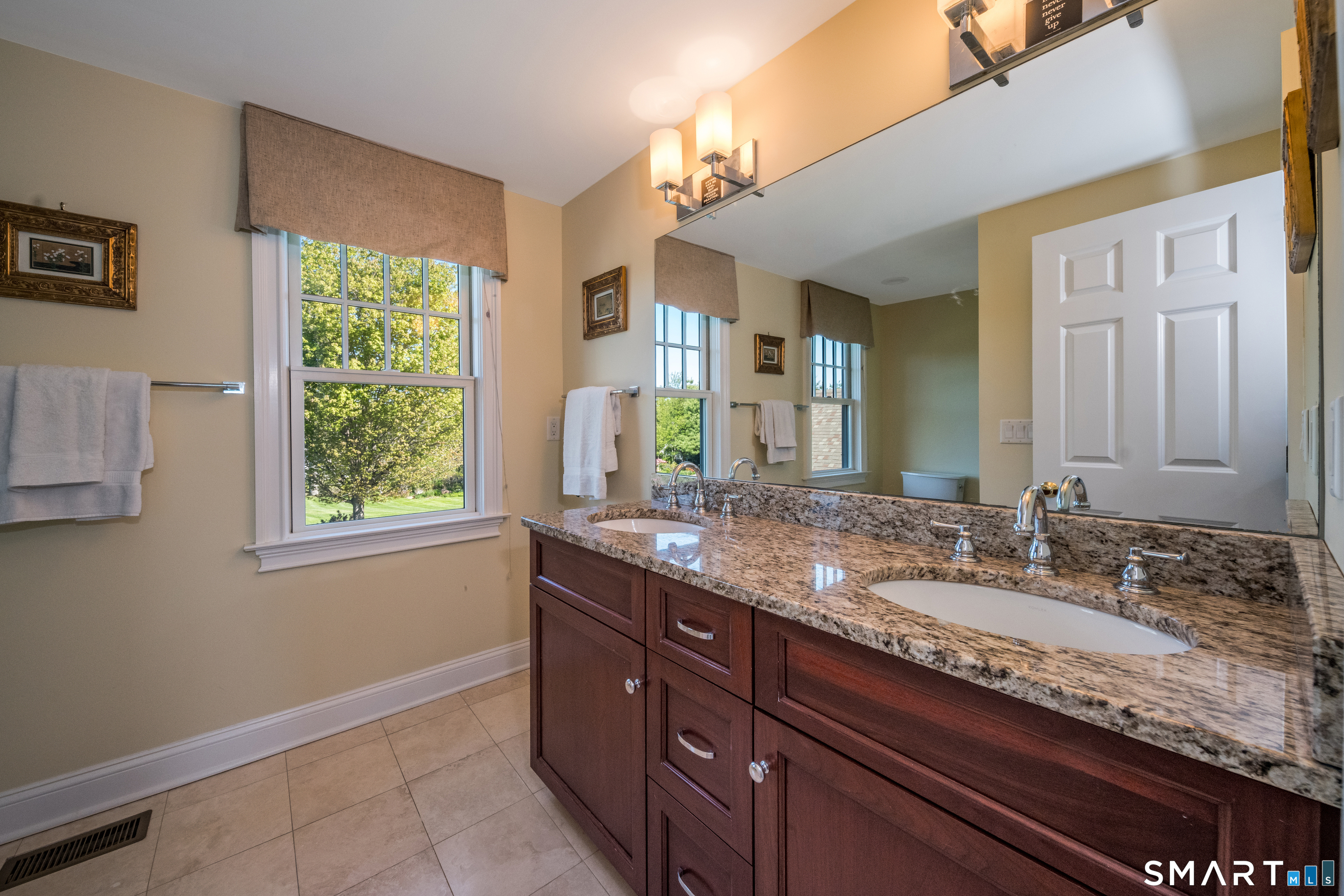 28 Walden Hill Road Guilford, CT 06437 - Photo 22 of 35 a bathroom with a granite countertop sink and a mirror