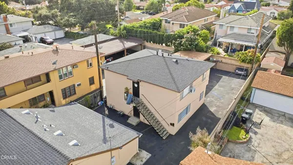 a view of a car park in front of house