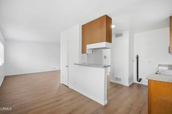 a room with a sink and a mirror