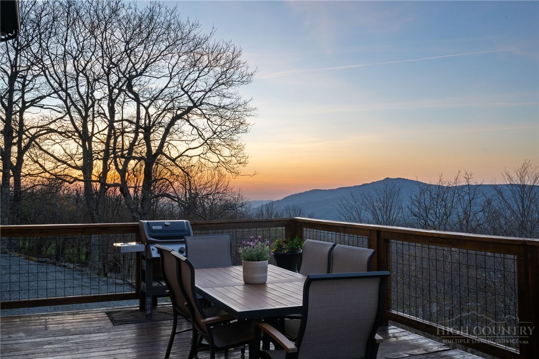 351 Windy Knob Trail Seven Devils, NC 28604 - Photo 45 of 50 a terrace of a house with wooden floor and outdoor seating