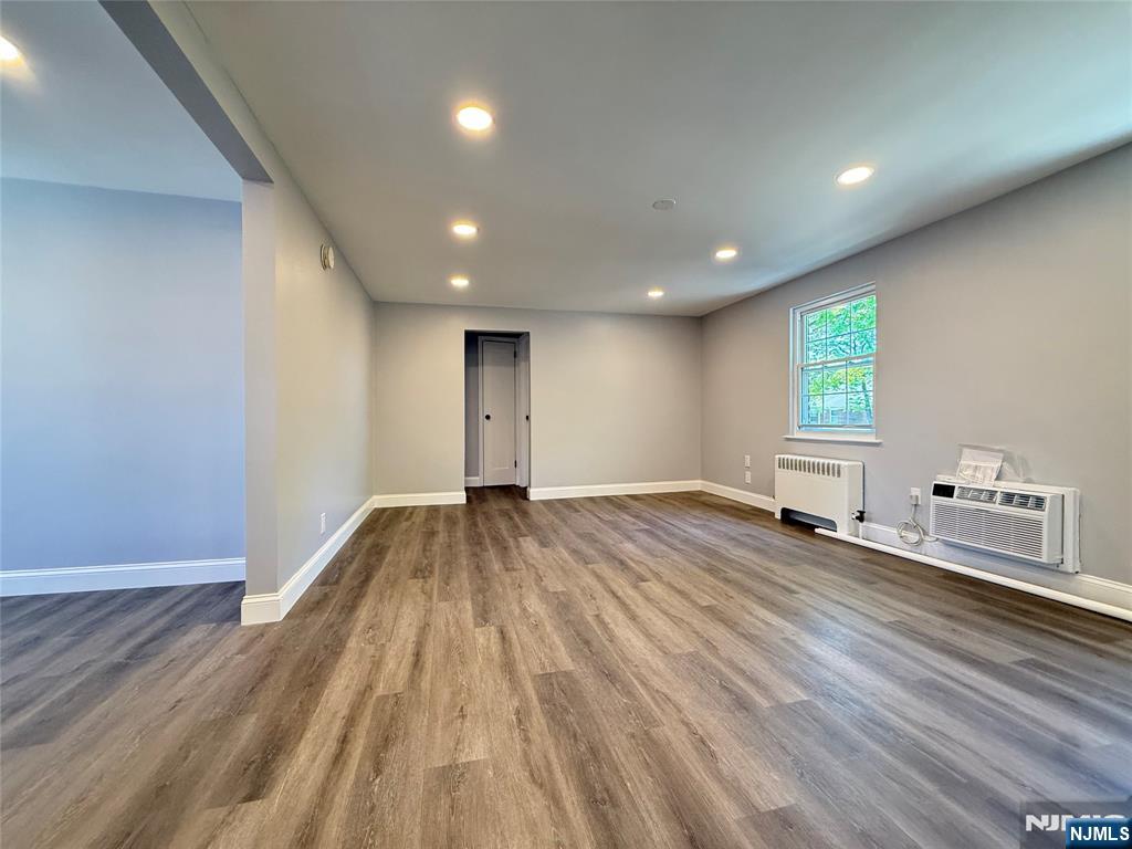 20 Clark Court Rutherford, NJ 07070 - Photo 5 of 29 a view of an empty room with wooden floor and a window