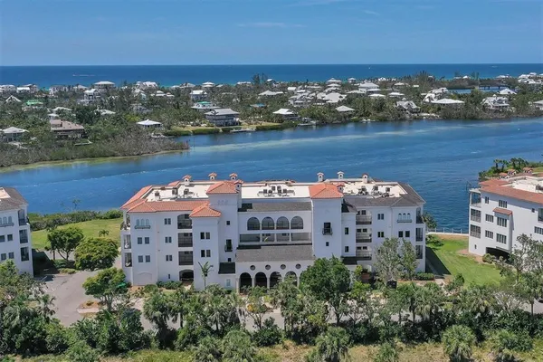 an aerial view of a house with a lake view