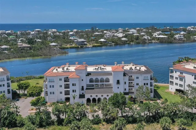 an aerial view of a house with a lake view