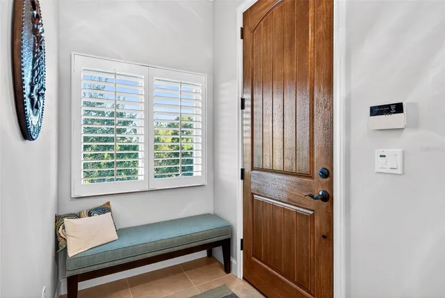 a kitchen with stainless steel appliances granite countertop a sink refrigerator and cabinets