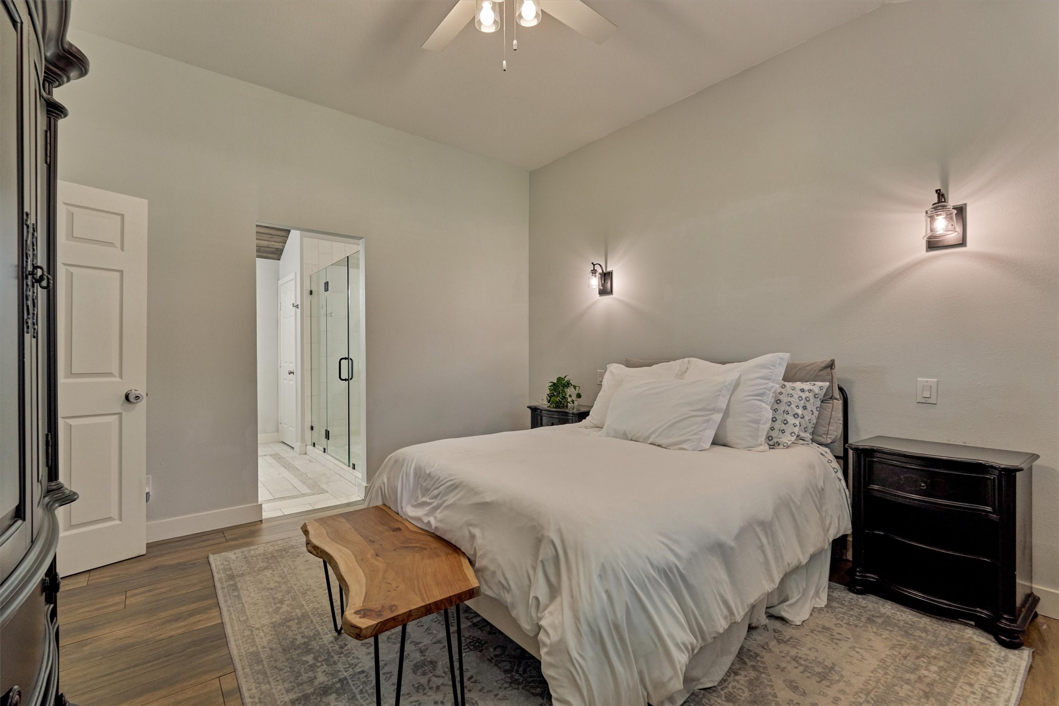 6515 Glenhill Drive Spring, TX 77389 - Photo 17 of 39 a bedroom with a bed and a chandelier