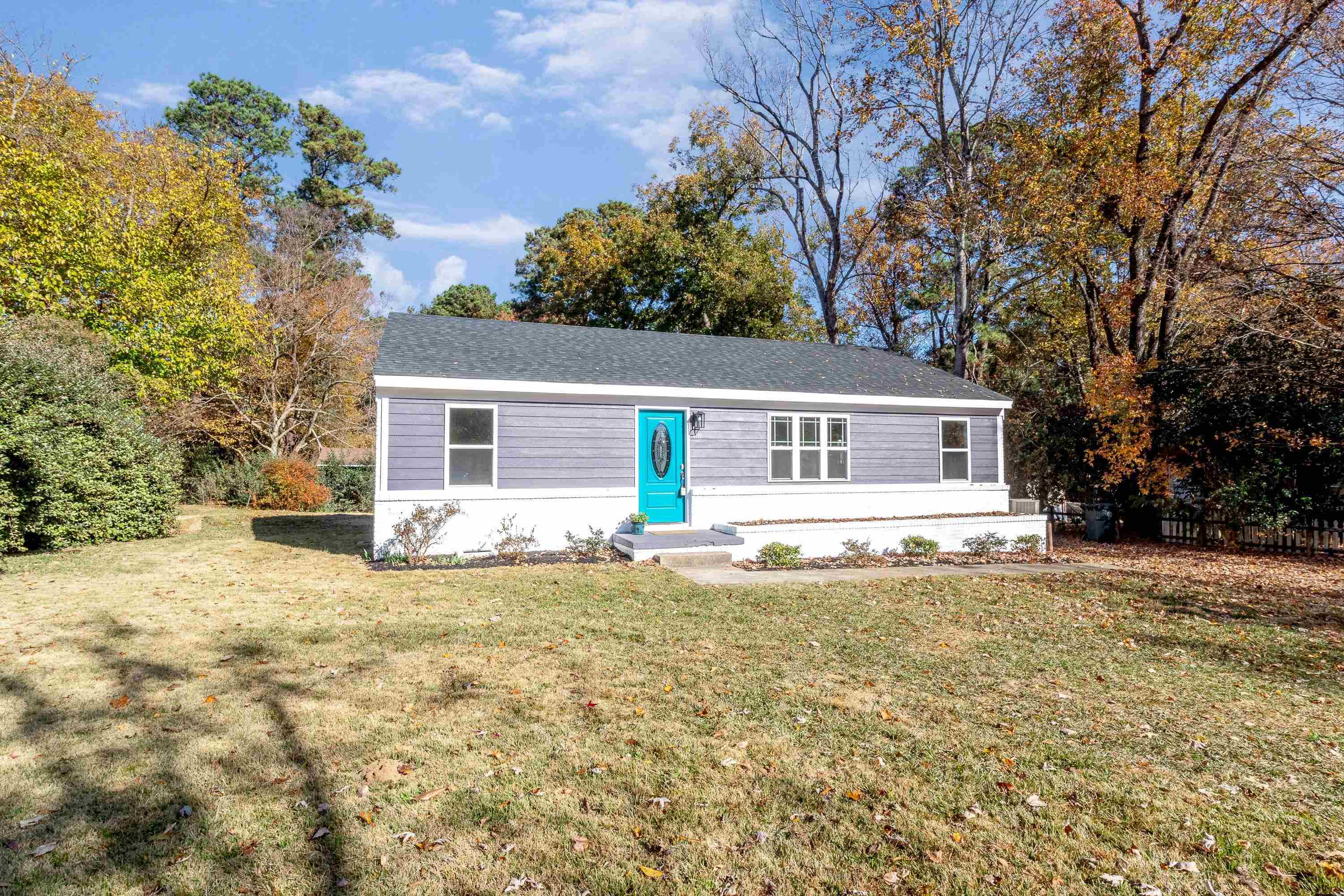1111 Southerlund Road Garner, NC 27529 - Photo 1 of 29 a front view of house with yard and trees in the background