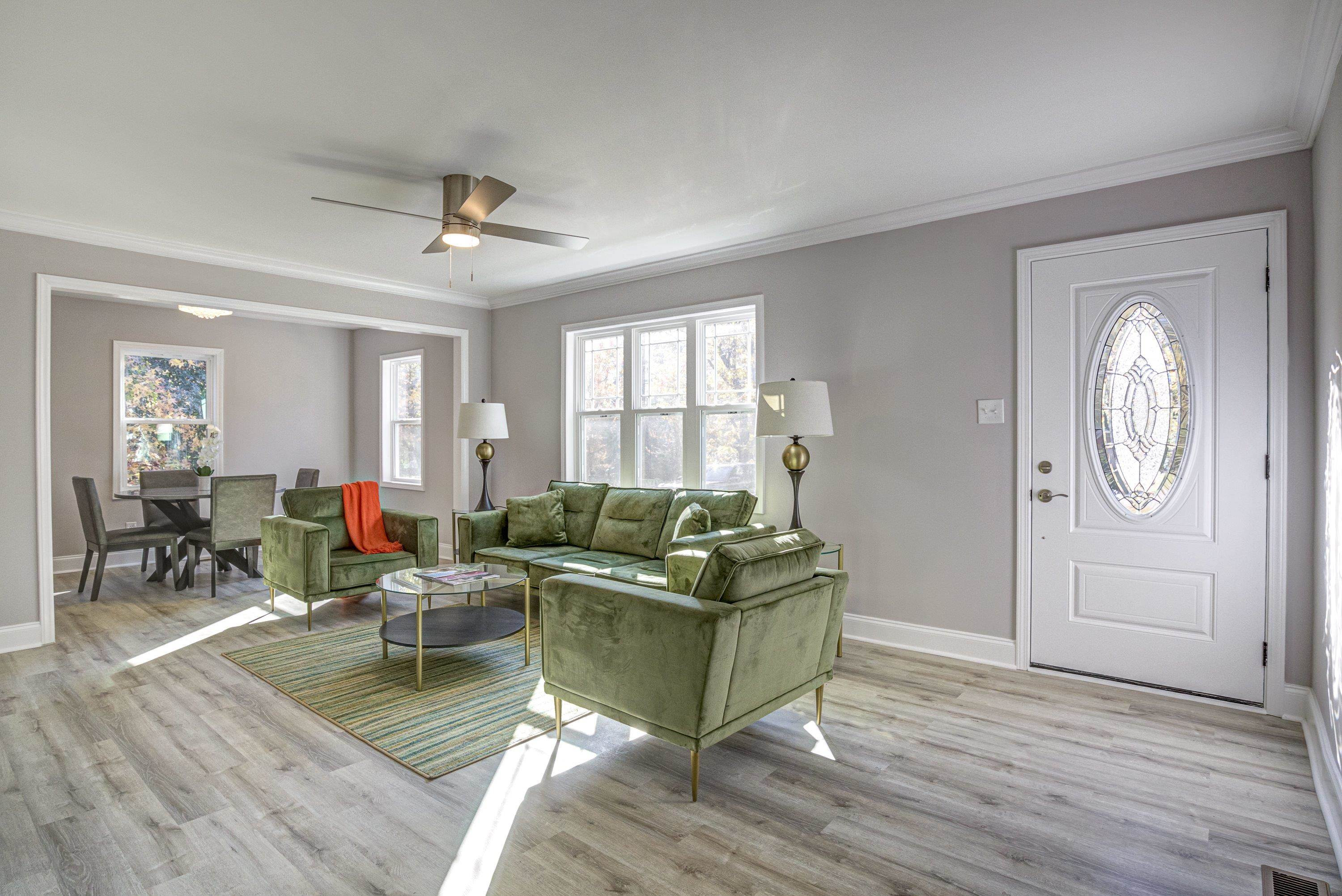 1111 Southerlund Road Garner, NC 27529 - Photo 4 of 29 a living room with furniture and a wooden floor