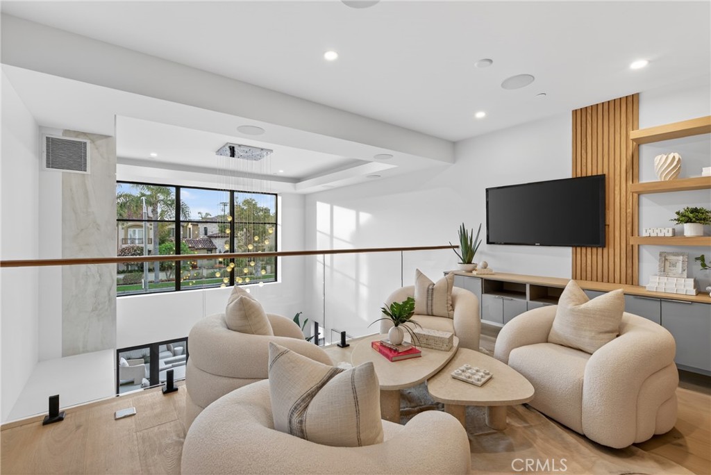520 11th Street Huntington Beach, CA 92648 - Photo 29 of 65 a living room with furniture and a flat screen tv